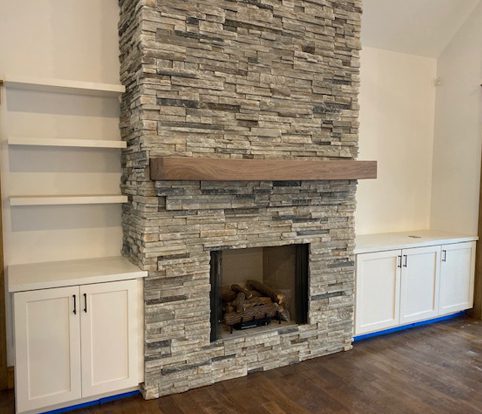 Rice Furniture & Design Center | custom wood mantle and cabinets surrounding brick fireplace Rice Furniture & Design Center | custom wood mantle and cabinets surrounding brick fireplace